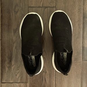 Skechers black slip on shoes.